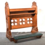 A Victorian carved oak kneeler