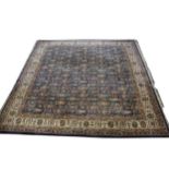 A large Persian pattern carpet