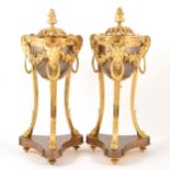 A pair of Louis XVI style bronzed and gilt metal cassolettes en athénienne,