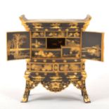 A Japanese black metal and gilt decorated 'kodansu' table cabinet