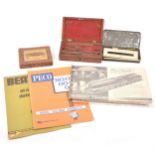 Selection of items including; drawing sets, Victorian printing set, Trix railway accessory, tins,