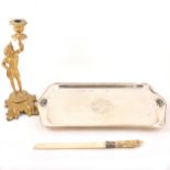 An Arts & Crafts silver-plated tray, a gilded candlestick and an Indian letter opener.