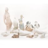 A collection of Lladro and Nao figurines.