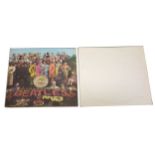 Two The Beatles LP vinyl records; Sgt Peppers, The White Album.