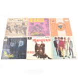 Six 7" vinyl singles, including the Beatles, The Rolling Stones and The Yardbirds