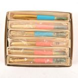 A retailer's 1950's box of twelve as new novelty "Diana Special" fountain pens with bathing belles.