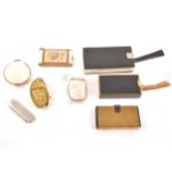 A collection of lady's vintage beauty accessories, compacts, aide memoir, manicure sets,