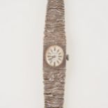 Accurist - a lady's silver bark textured bracelet watch.