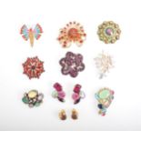 Twenty-two vintage 1950's colourful paste brooches and earrings.