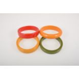 Four vintage coloured bakelite solid bangles.