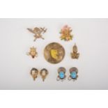 A collection of of Siamese, Chinese and other novelty clips, pins and earrings.