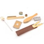 A collection of vintage items, lighter, cut throat razor, brass vesta case,