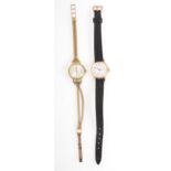 Two lady's vintage wrist watches with gold elements.