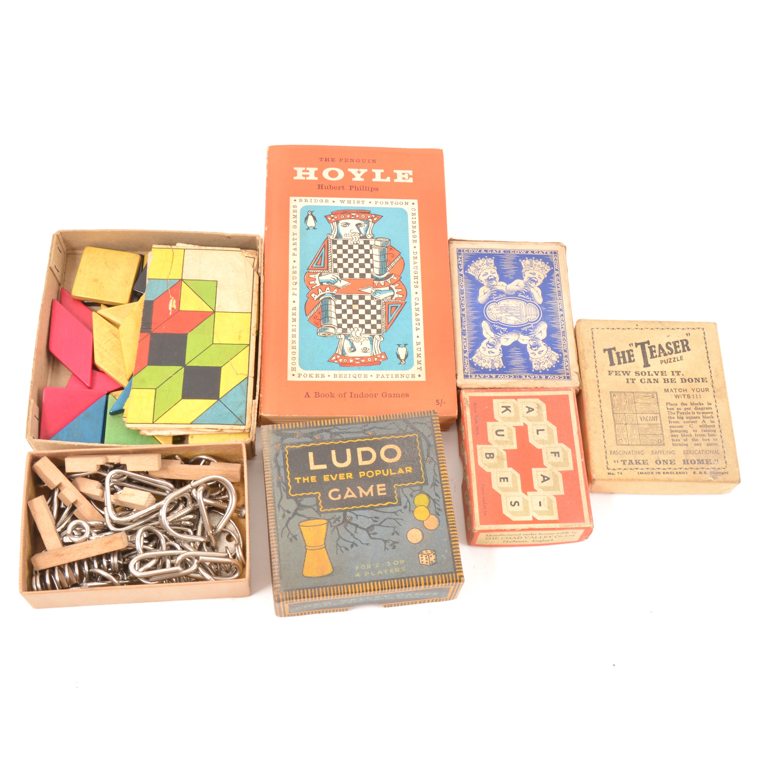A box of vintage games; including puzzles, Dominoes, playing cards, Ludo, etc