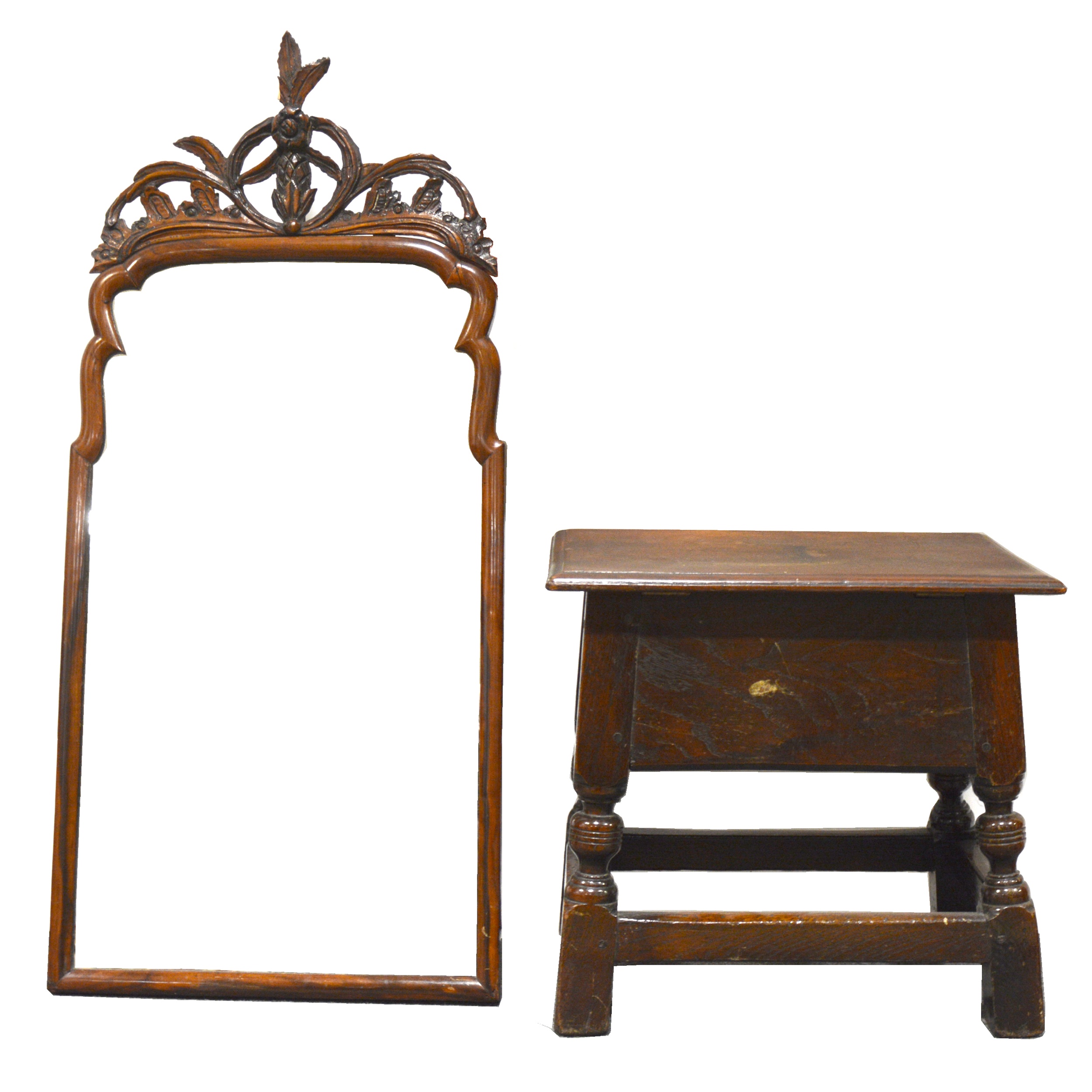 A carved oak box stool and a mirror