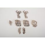 Keim of London, and in the style of, a collection of eight white and silver metal clips and pins,
