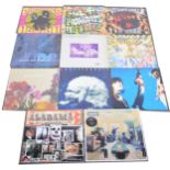 Twelve LP and 12" single vinyl records; mostly 1990s music