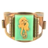 A 1930s Art Deco Hippocampe bangle retailed by JHP of Paris