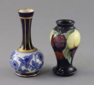 A small Moorcroft 'wisteria' vase and a Macintyre bottle vase, 1920's and c.1905, the former with