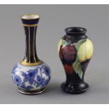 A small Moorcroft 'wisteria' vase and a Macintyre bottle vase, 1920's and c.1905, the former with