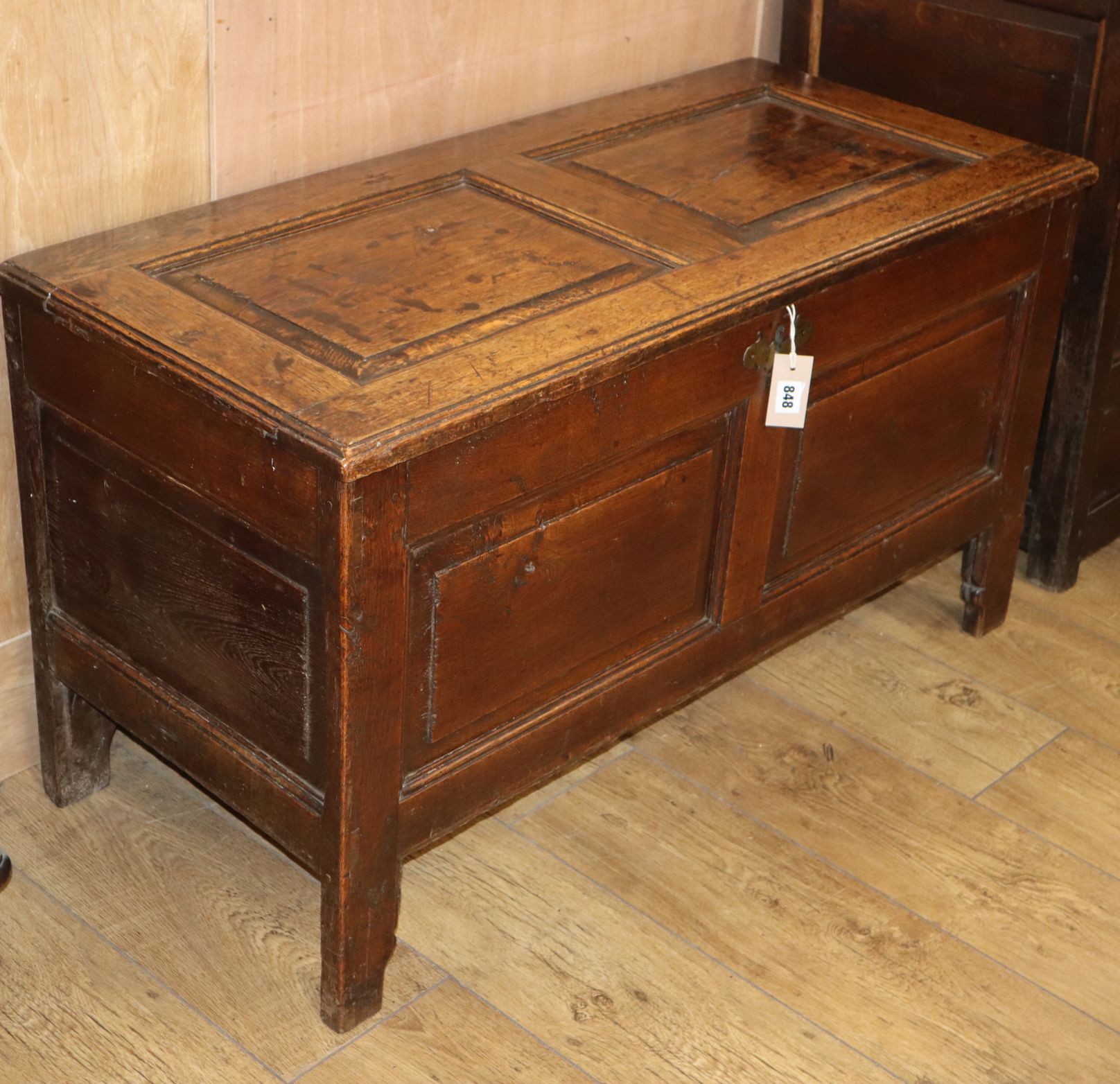 An 18th century panelled oak coffer W.105cm