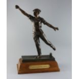 Émile Grégoire (1871-1948). A bronze boulle trophy, depicting a boulle player about to cast a throw,