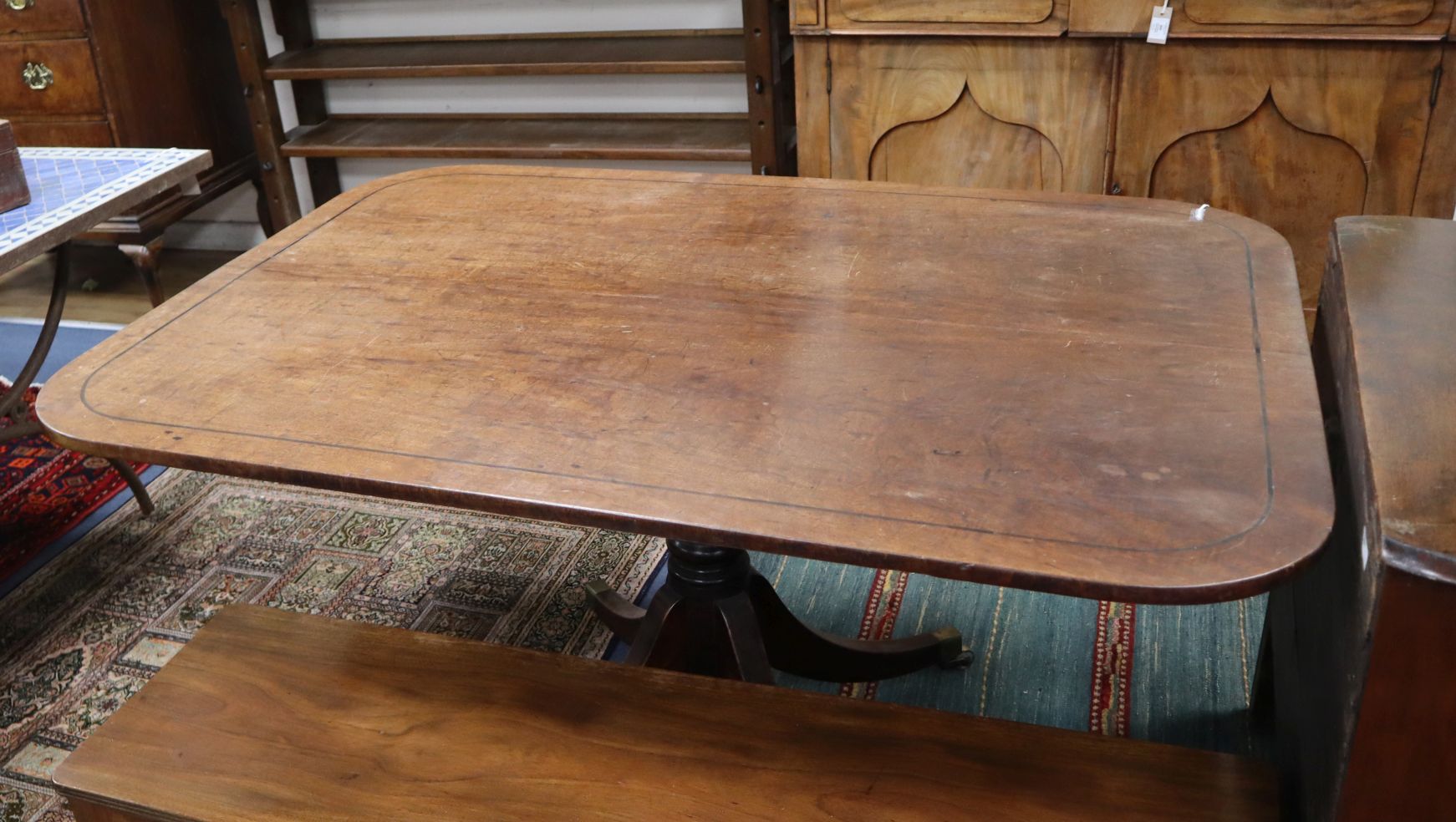 A Regency mahogany tilt top rectangular breakfast table W.143cm
