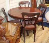 A Victorian mahogany circular tilt top breakfast table and a set of four Victorian mahogany dining