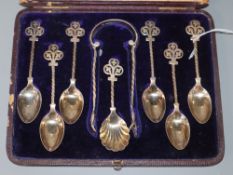 A Victorian cased set of six silver teaspoons, tongs and caddy spoon, by Jehoiada Alsop Rhodes,