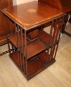 An Edwardian style inlaid mahogany revolving bookcase W.48cm