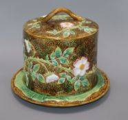 A George Jones majolica 'wild rose' pattern cheese dome on stand height 26cm