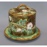 A George Jones majolica 'wild rose' pattern cheese dome on stand height 26cm