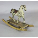 A rare Victorian carved and painted wood dapple grey rocking horse, of small proportions, with