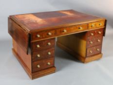 A Victorian mahogany twin-pedestal partner's desk, fitted red leather skiver over three frieze