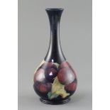 A Moorcroft 'pansy' bottle vase, c.1917, impressed marks Moorcroft Burslem England 50, inscribed