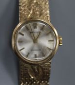 A lady's 9ct gold Rolex Precision manual wind wrist watch, on a fancy 9ct Rolex bracelet.