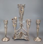 A pair of silver candlesticks, six silver spoons and a plated epergne