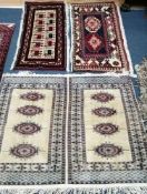 A Bokhara mat and two other Persian mats largest 128 x 94cm