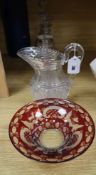 An early Victorian glass water jug, three Regency decanters and a Bohemian ruby glass bowl (5)