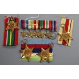 A WW2 medal group of six to Lieut. G.I.L. Greenlees RNVR and matching miniatures