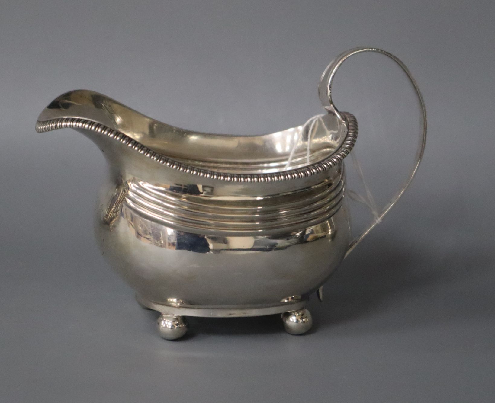 A George III silver helmet shaped cream jug, London, 1814.