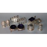 A pair of George V silver toast racks, Sheffield, 1934 and seven assorted silver condiments