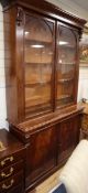 A Victorian mahogany bookcase cupboard W.122cm