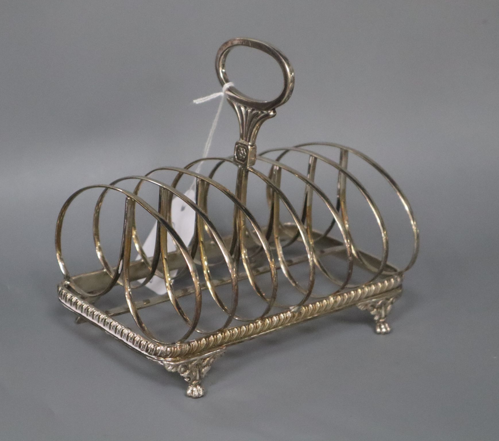 A George IV silver six division toast rack, Joseph Angell I, London, 1825, length 16cm.