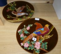 A pair of Schuz Cilli wall dishes, decorated with birds diameter 44cm