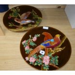 A pair of Schuz Cilli wall dishes, decorated with birds diameter 44cm