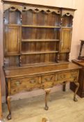 A Georgian style oak dresser W.152cm