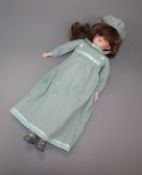 A German Armand Marseille bisque head and shoulder doll with sleeping eyes and jointed body.