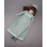 A German Armand Marseille bisque head and shoulder doll with sleeping eyes and jointed body.