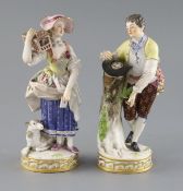 Two Meissen figures of a boy with a bird nest and girl with a bird cage, late 19th century, each